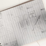 Open blank sheet of sketchbook on spiral, light background, top view, flat lay, copy space