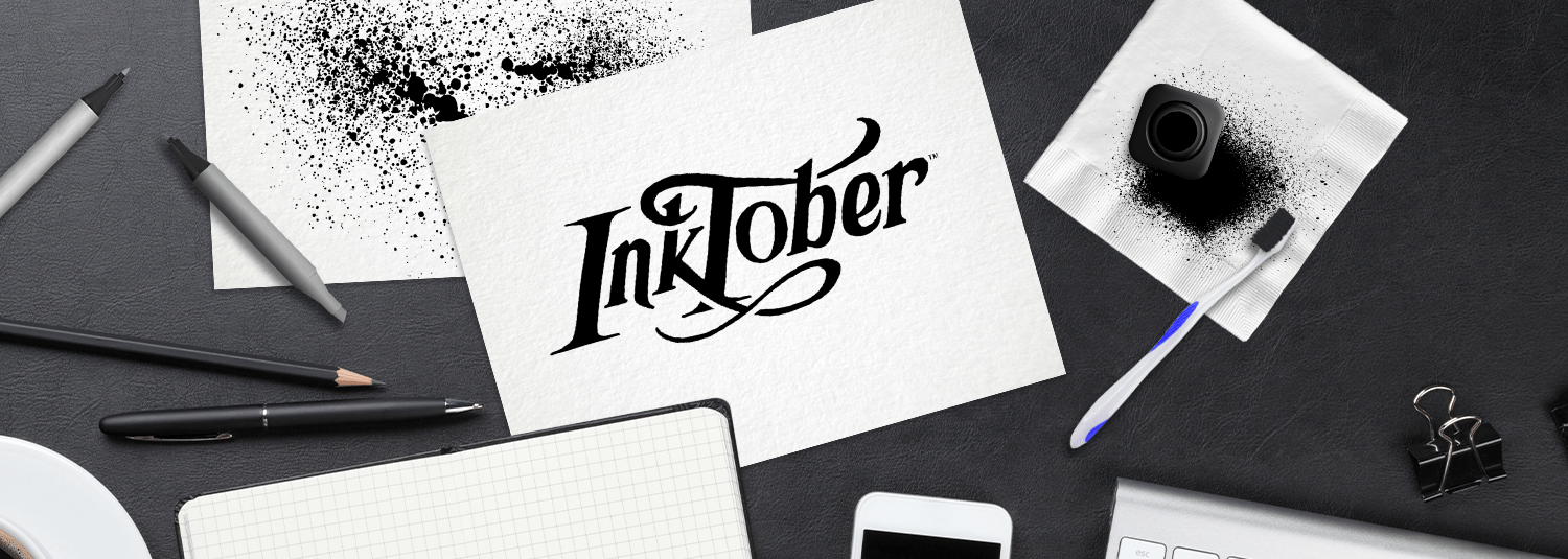 Inktober header, desk view with paper and ink